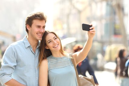 A couple taking a selfie showing how Invisalign from our Scottsdale AZ dentist straightens your smile discreetly